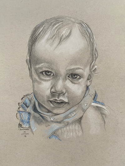 baby met blauw-wit gesptreepte broek en slabbertje